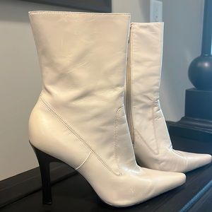 Creamy white boot with black 3 1/2” heel.